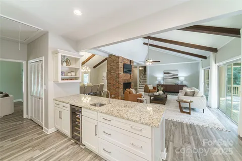 a view of living room with granite countertop furniture and fireplace