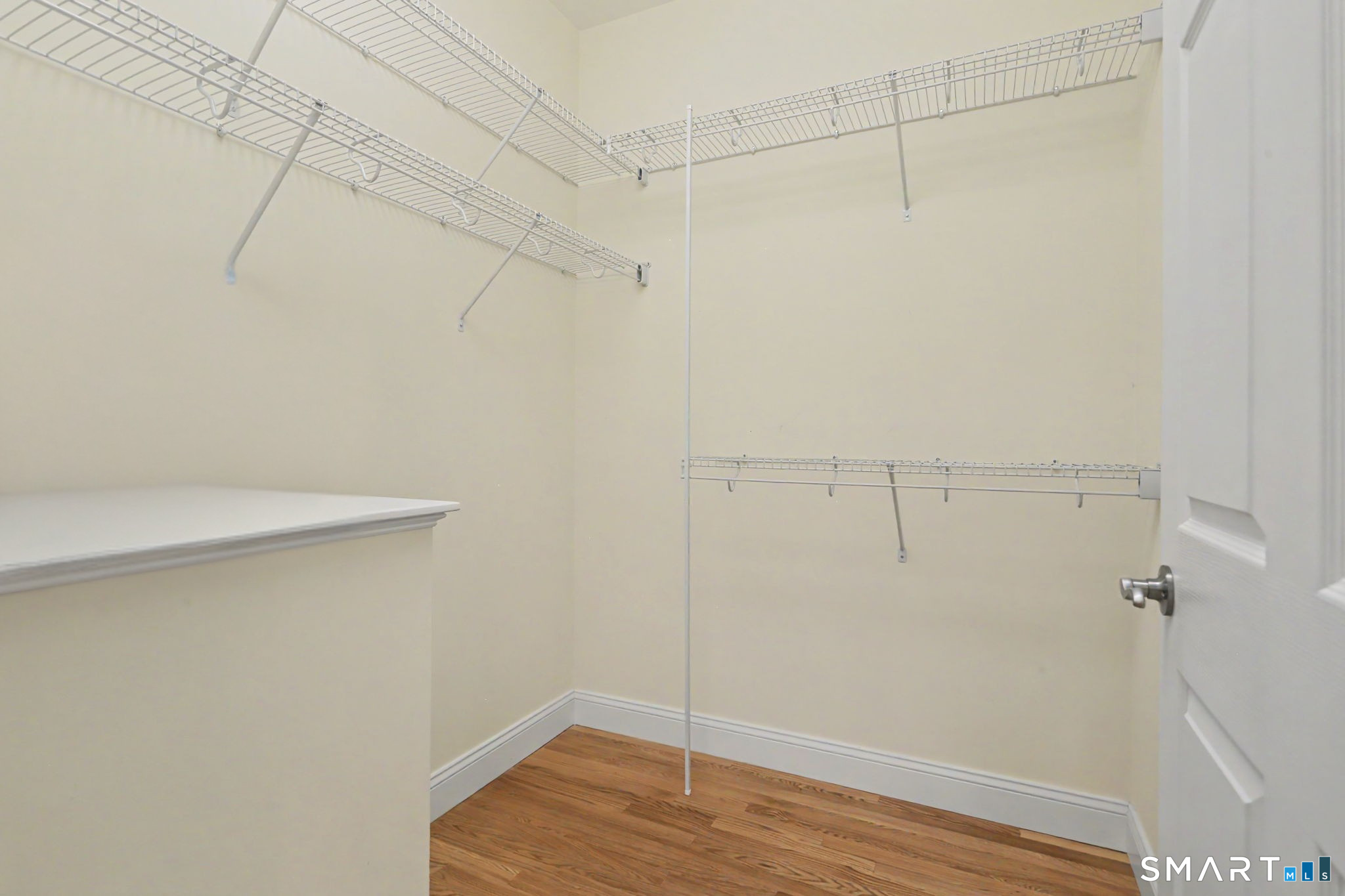 223 Meadow Brook Road, Unit 223 Oxford, CT 06478 - Photo 19 of 34 a view of a room with racks on the wall
