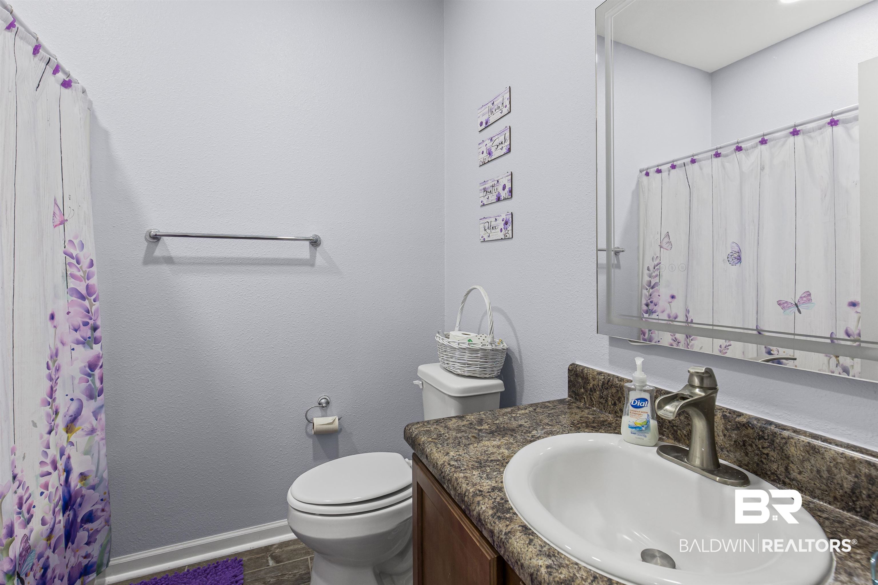 4107 Nottingham Drive Semmes, AL 36575 - Photo 14 of 23 Bathroom with vanity, a textured wall, and a shower with shower curtain