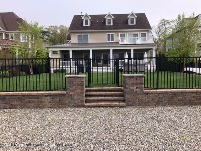 647 Bancroft Road Brick, NJ 08724 - Photo 3 of 45 Back of Home with Retaining Wall