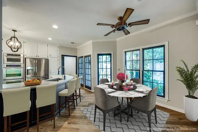a view of a dining room with furniture window and wooden floor