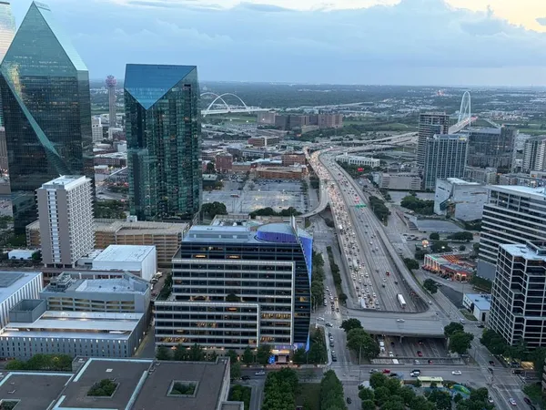 a living room with furniture and floor to ceiling windows