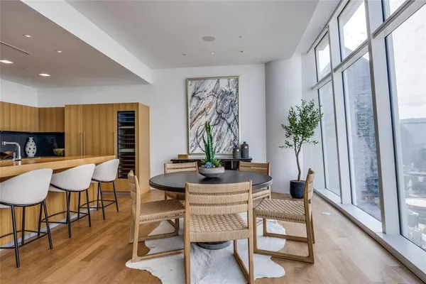 a kitchen with stainless steel appliances a sink a stove and cabinets