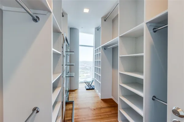 a bedroom with a large bed and a large window