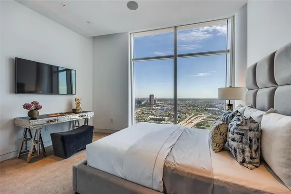 a bathroom with a sink toilet a mirror and shower