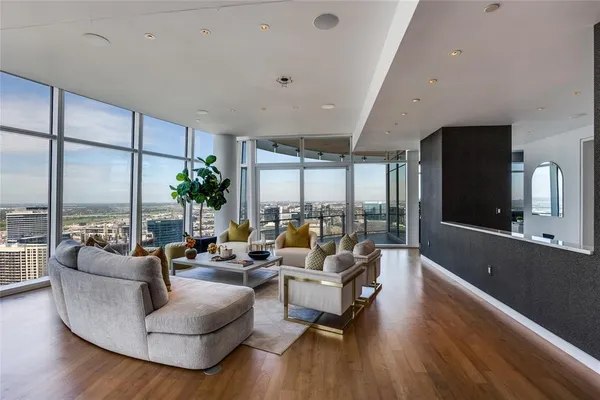 a living room with furniture and a rug