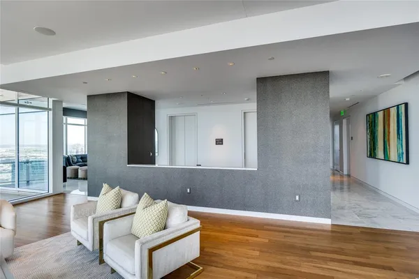 a view of a dining room with furniture and a potted plant