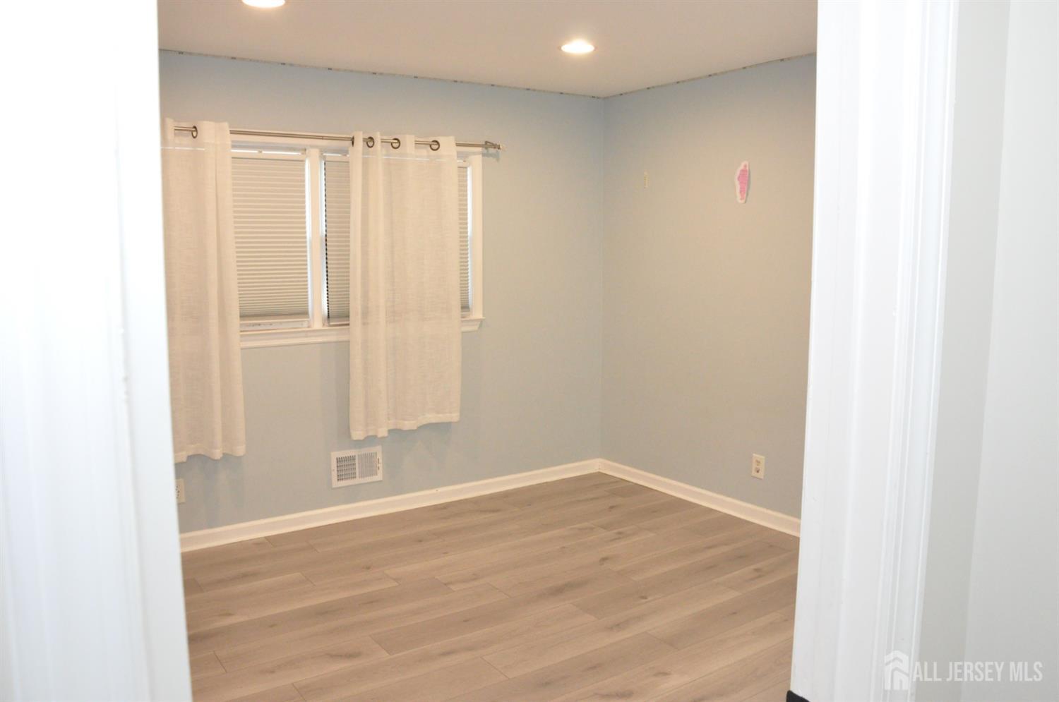 32 Harmon Road Edison, NJ 08837 - Photo 23 of 52 a view of a room with wooden floor