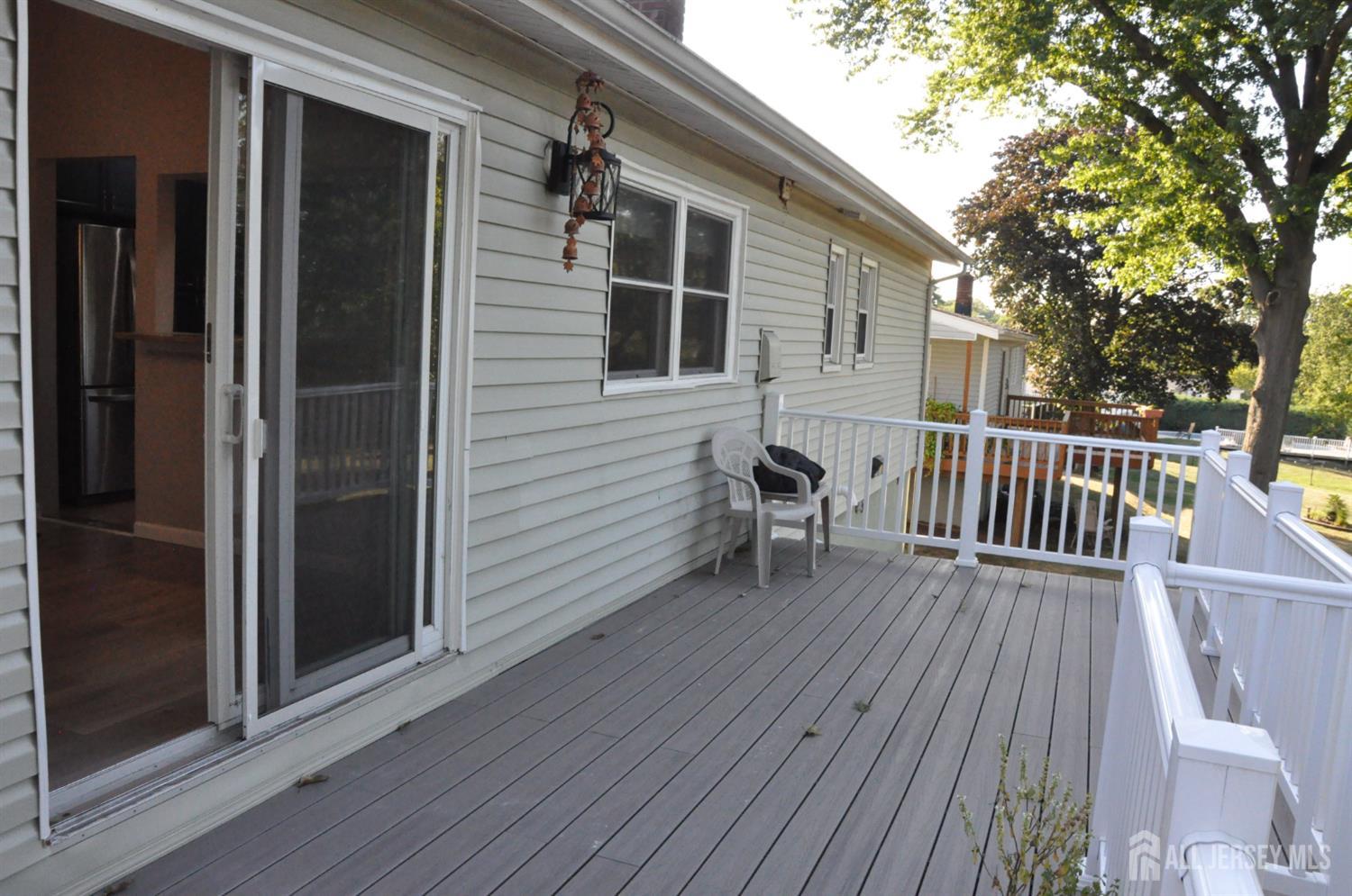 32 Harmon Road Edison, NJ 08837 - Photo 27 of 52 a view of backyard with deck and wooden floor