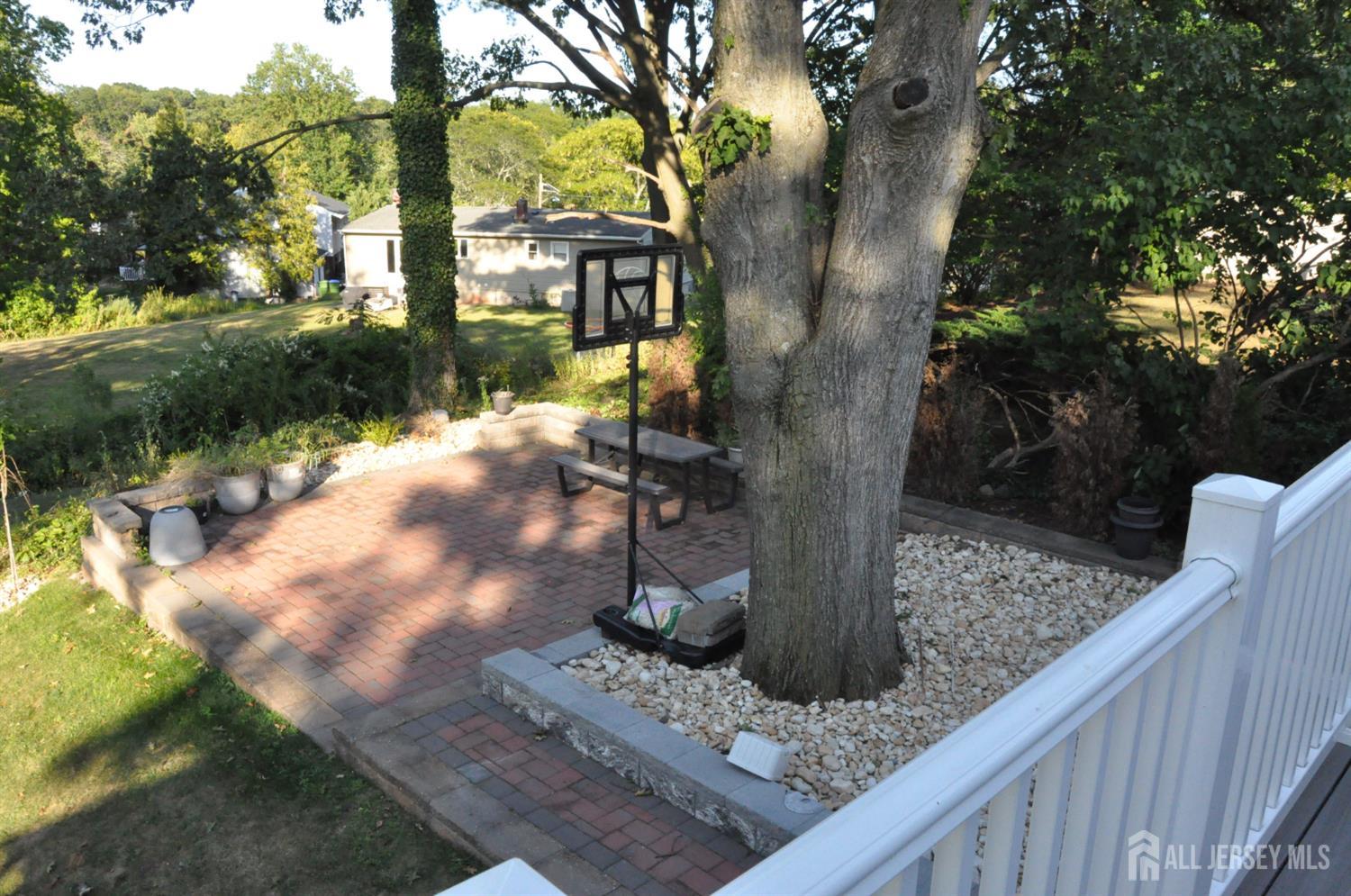 32 Harmon Road Edison, NJ 08837 - Photo 32 of 52 a view of a tree in front of a house