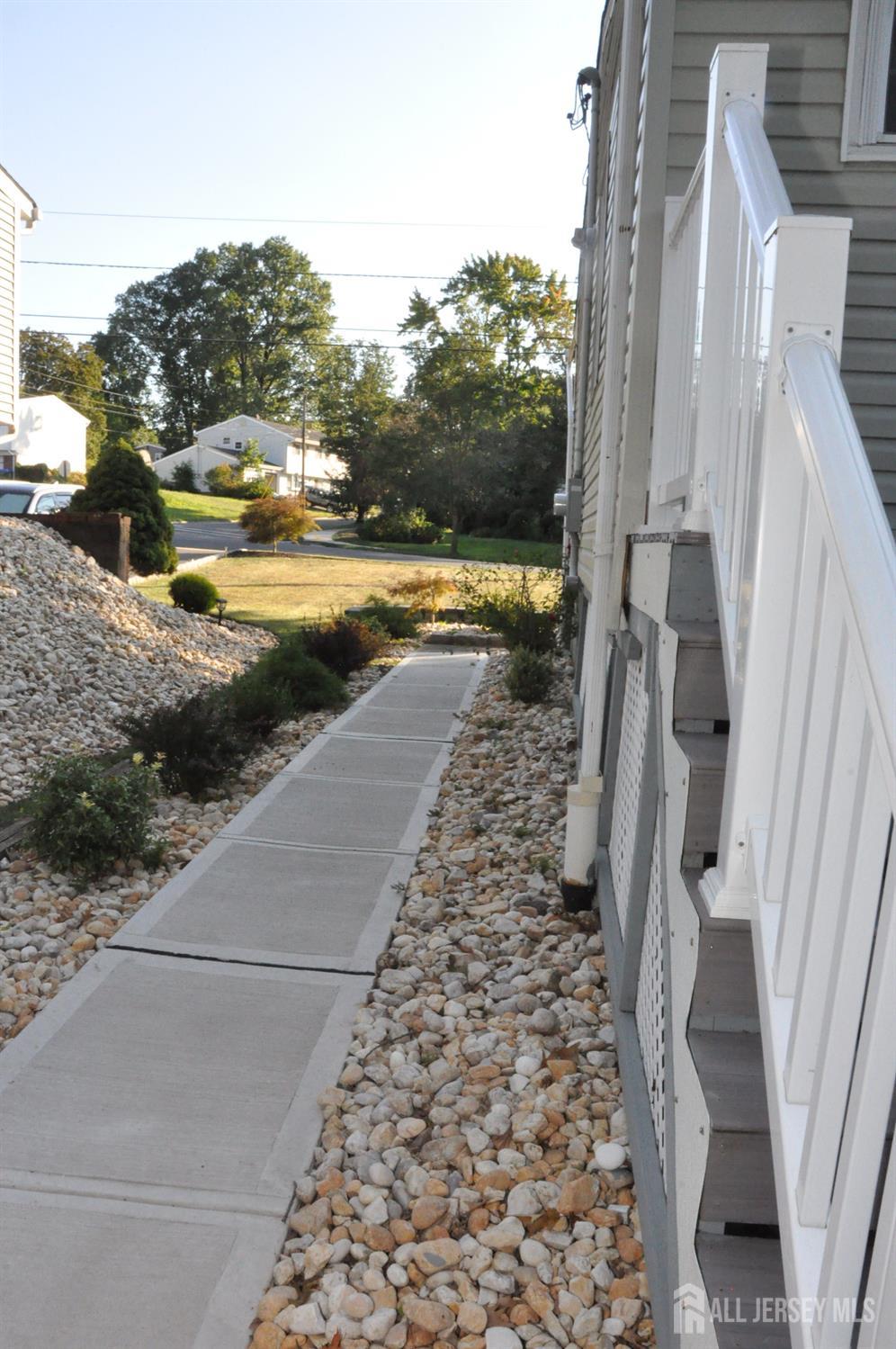 32 Harmon Road Edison, NJ 08837 - Photo 42 of 52 a view of a yard with an outdoor space