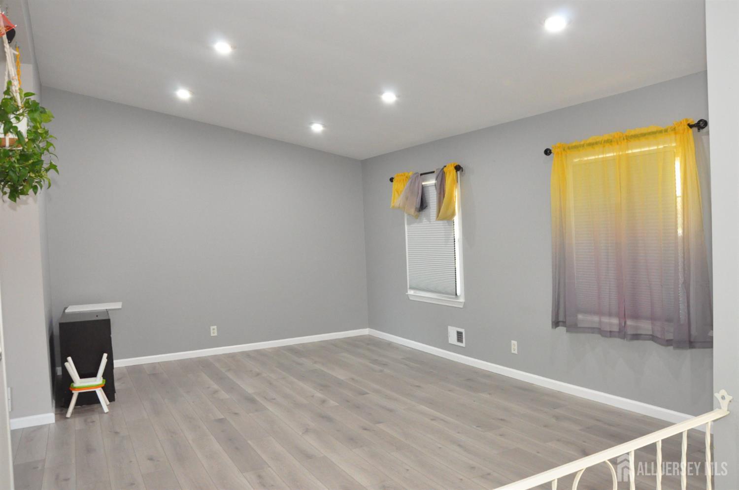 32 Harmon Road Edison, NJ 08837 - Photo 10 of 52 a view of a room with wooden floor and a window