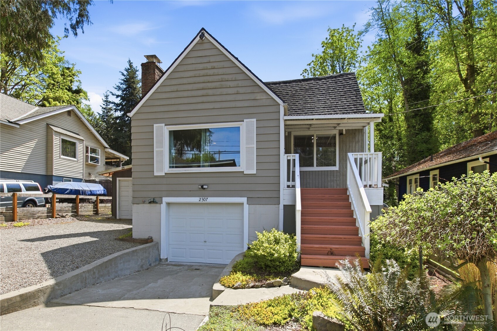 2307 Southwest Myrtle Street Seattle, WA 98106 - Photo 1 of 30 a front view of a house with a yard