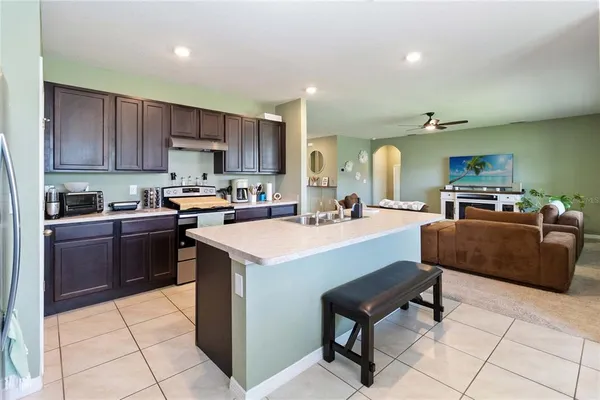 a kitchen with a sink a counter top space and appliances