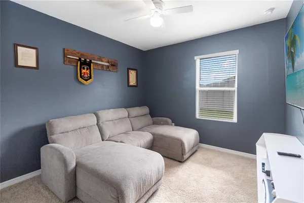 a living room with furniture and a window