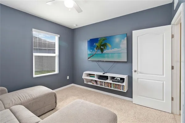 a bedroom with furniture and a window