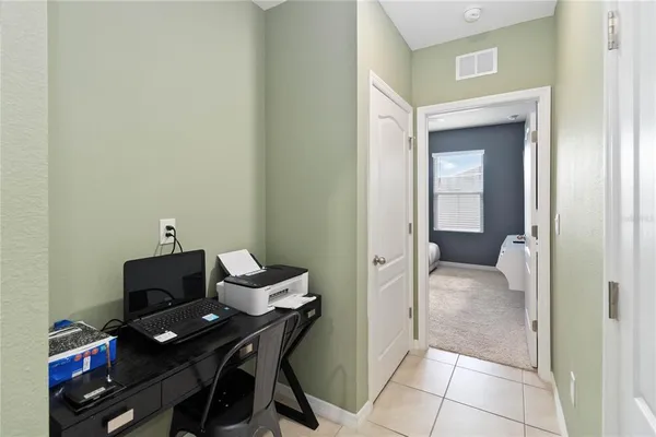 a view of a workspace with furniture