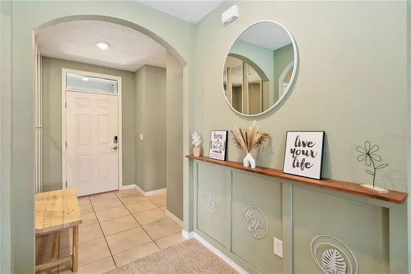 a front view of a house with grey walls