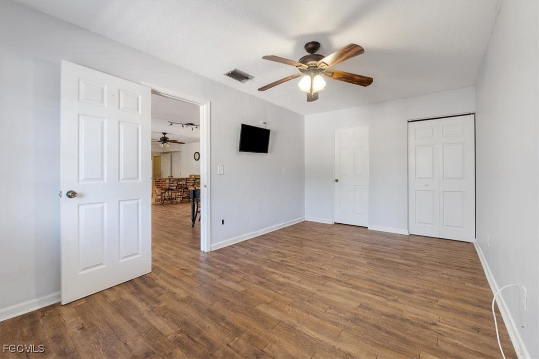 610 East Avenida Del Rio Clewiston, FL 33440 - Photo 18 of 49 a view of an empty room with wooden floor
