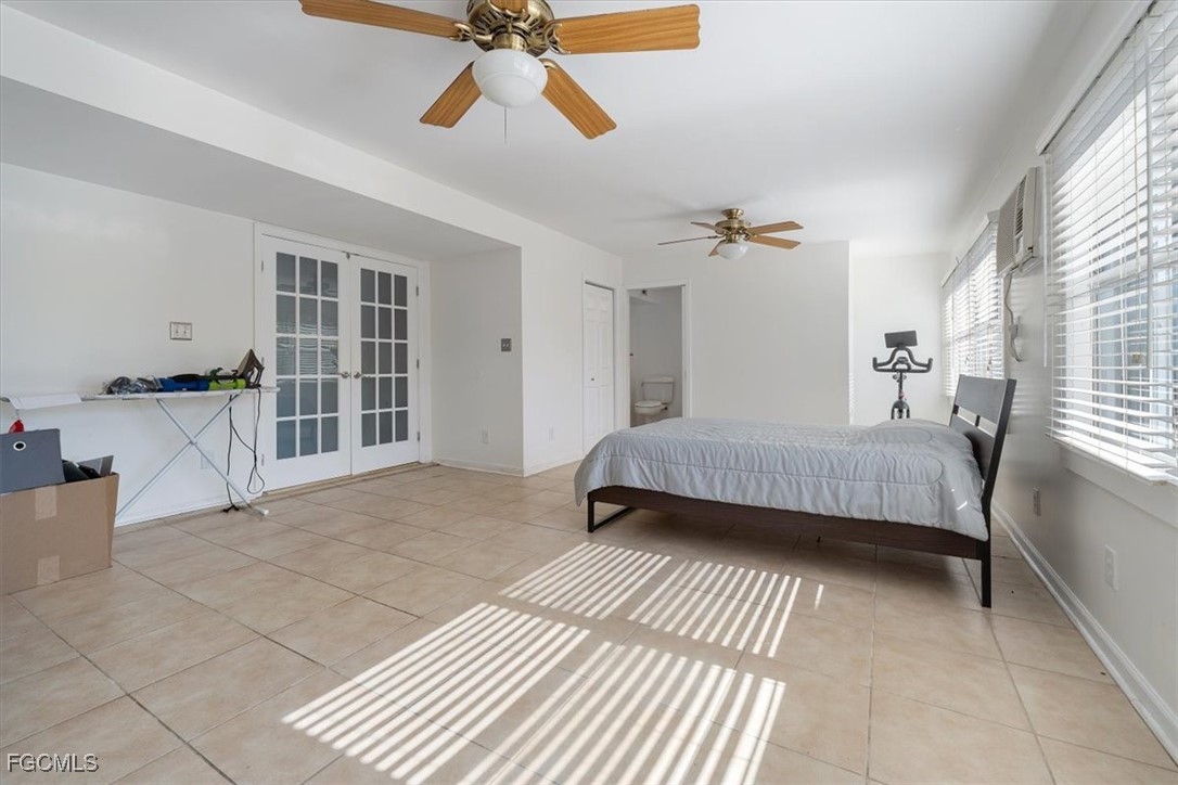 610 East Avenida Del Rio Clewiston, FL 33440 - Photo 21 of 49 a bedroom with a bed and wooden floor