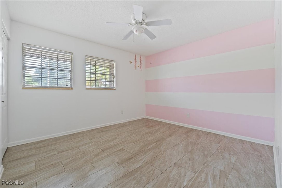 610 East Avenida Del Rio Clewiston, FL 33440 - Photo 26 of 49 wooden floor in an empty room with a window