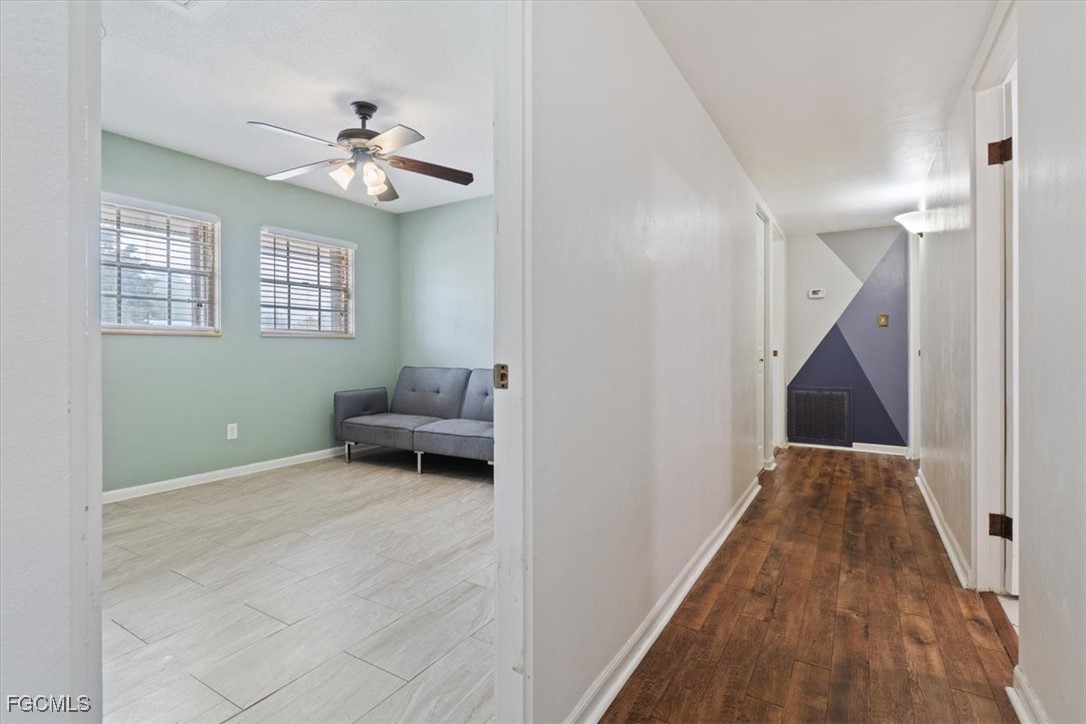 610 East Avenida Del Rio Clewiston, FL 33440 - Photo 32 of 49 a view of a livingroom with wooden floor and staircase