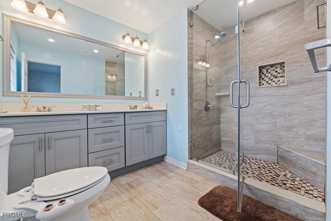 610 East Avenida Del Rio Clewiston, FL 33440 - Photo 39 of 49 a bathroom with a toilet a sink and shower