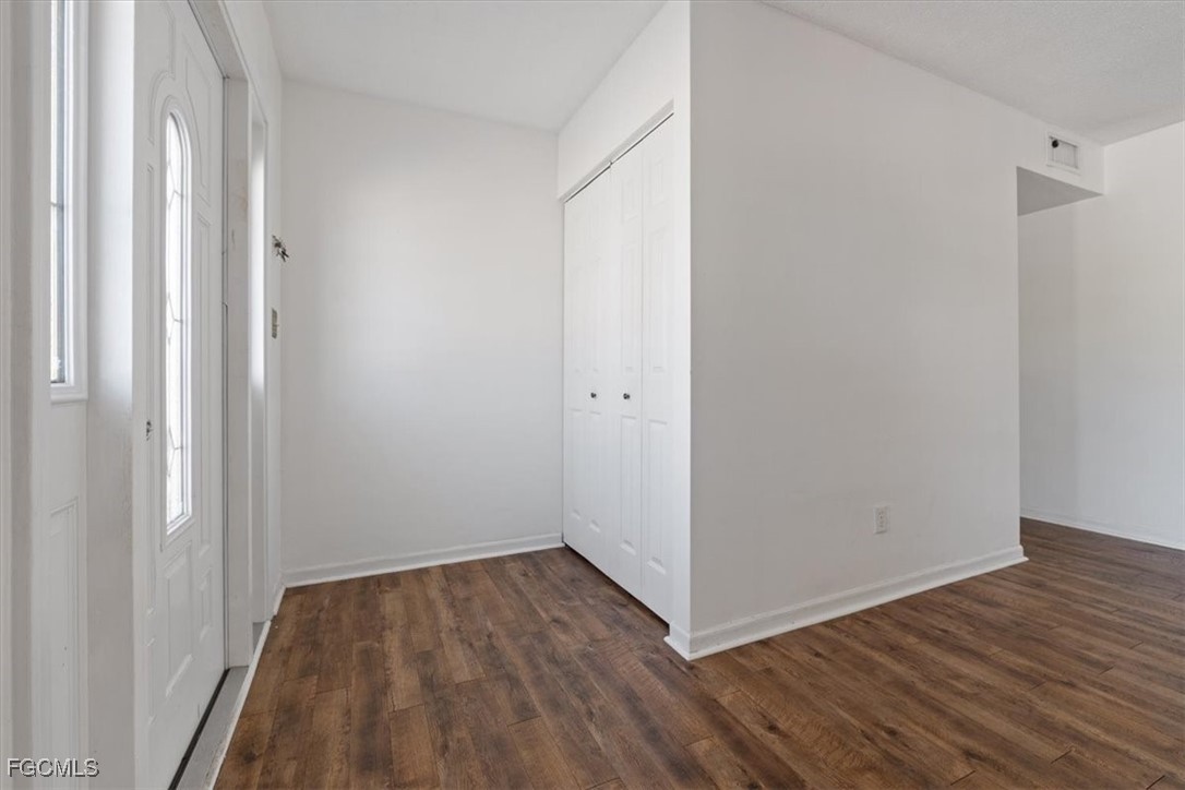 610 East Avenida Del Rio Clewiston, FL 33440 - Photo 6 of 49 a view of a room with wooden floor