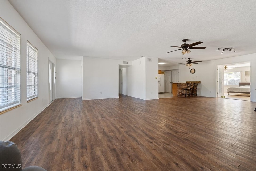 610 East Avenida Del Rio Clewiston, FL 33440 - Photo 7 of 49 wooden floor in an empty room with a window