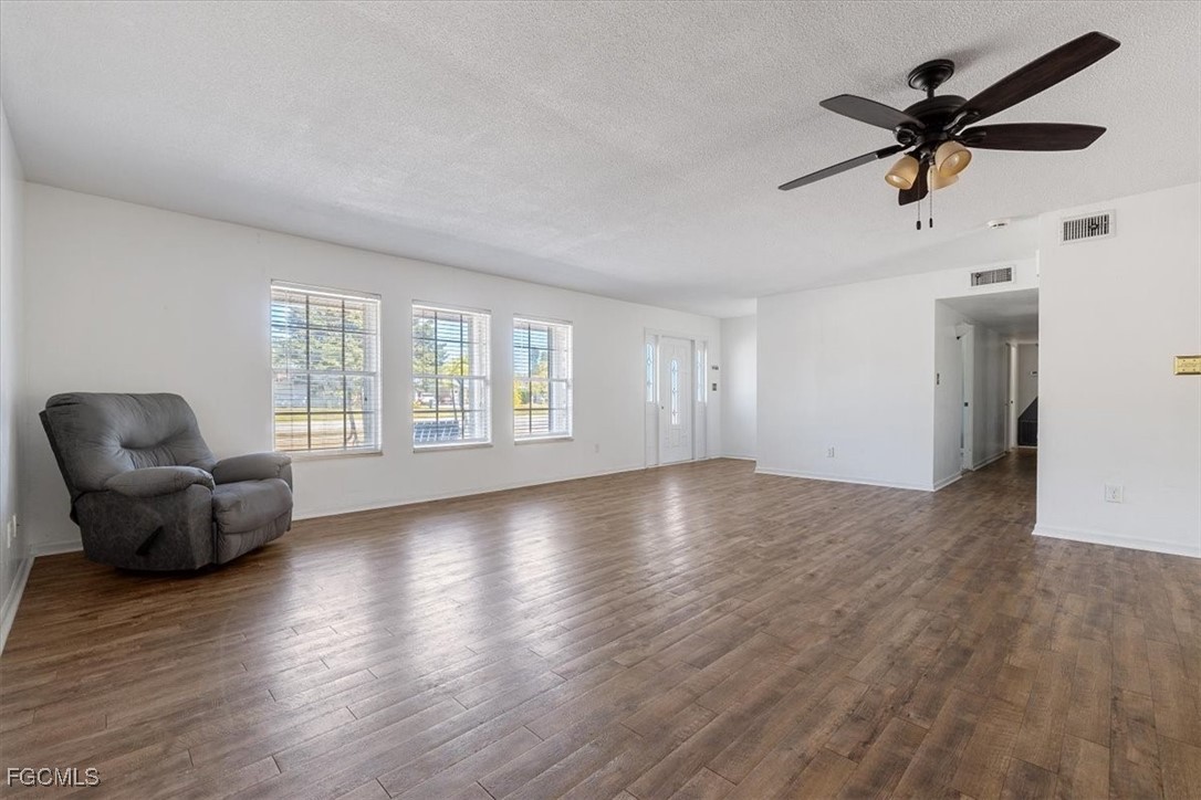 610 East Avenida Del Rio Clewiston, FL 33440 - Photo 8 of 49 a view of livingroom with hardwood floor and ceiling fan