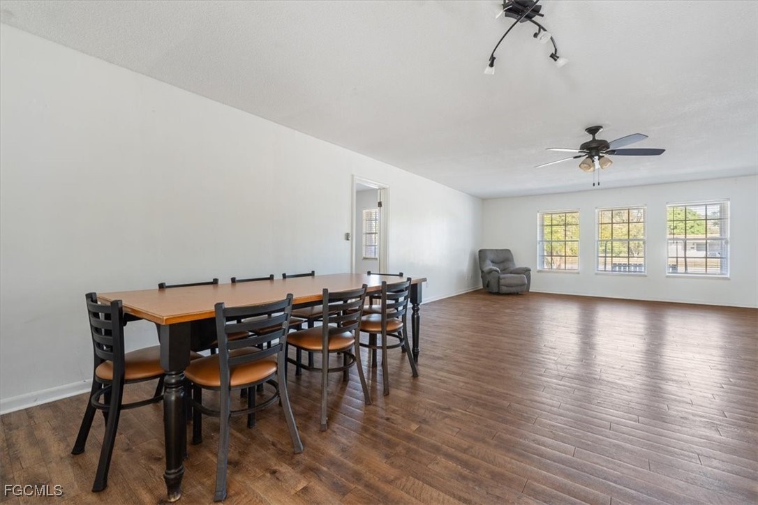 610 East Avenida Del Rio Clewiston, FL 33440 - Photo 10 of 49 a view of a dining room with furniture and wooden floor