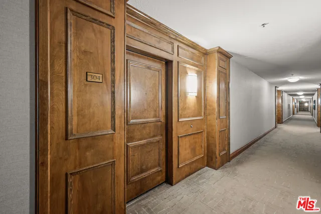 a view of an empty room with a kitchen
