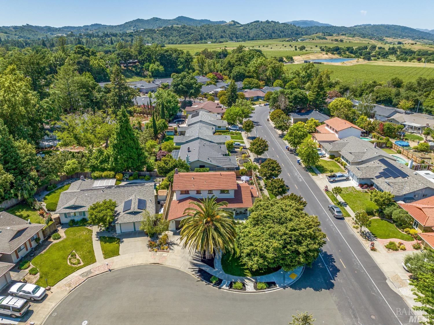 an aerial view of a city with streets and houses