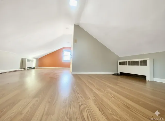 a view of staircase with white walls and a window