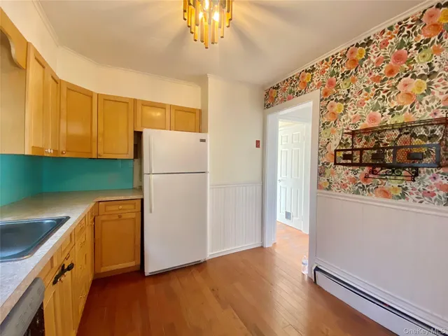 a bathroom with a sink and mirror with toilet