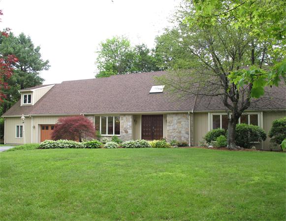 12 Idylwilde Road Lexington, MA 02421 - Photo 1 of 1 a front view of house with yard and green space