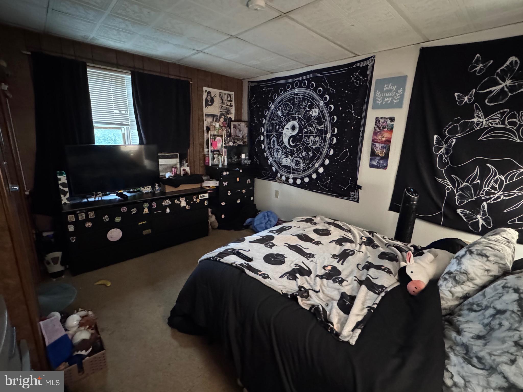 1128 North 6th Street Reading, PA 19601 - Photo 11 of 19 a bedroom with a bed and a flat screen tv