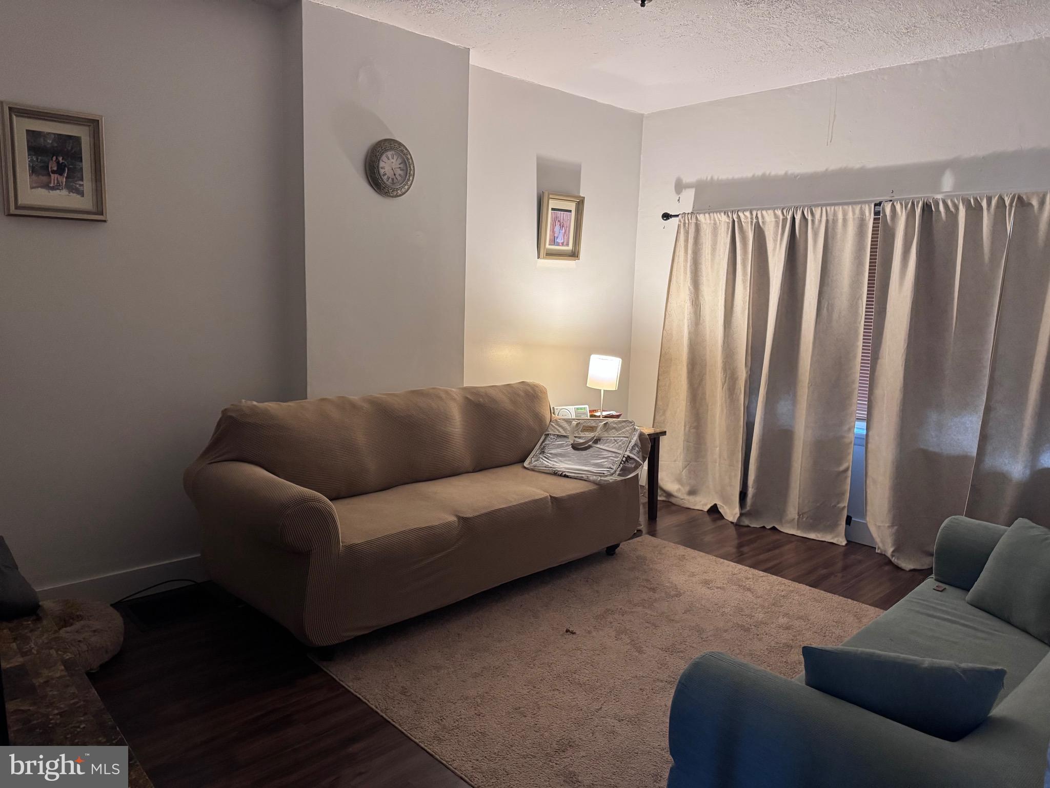 1128 North 6th Street Reading, PA 19601 - Photo 4 of 19 a living room with furniture and a window