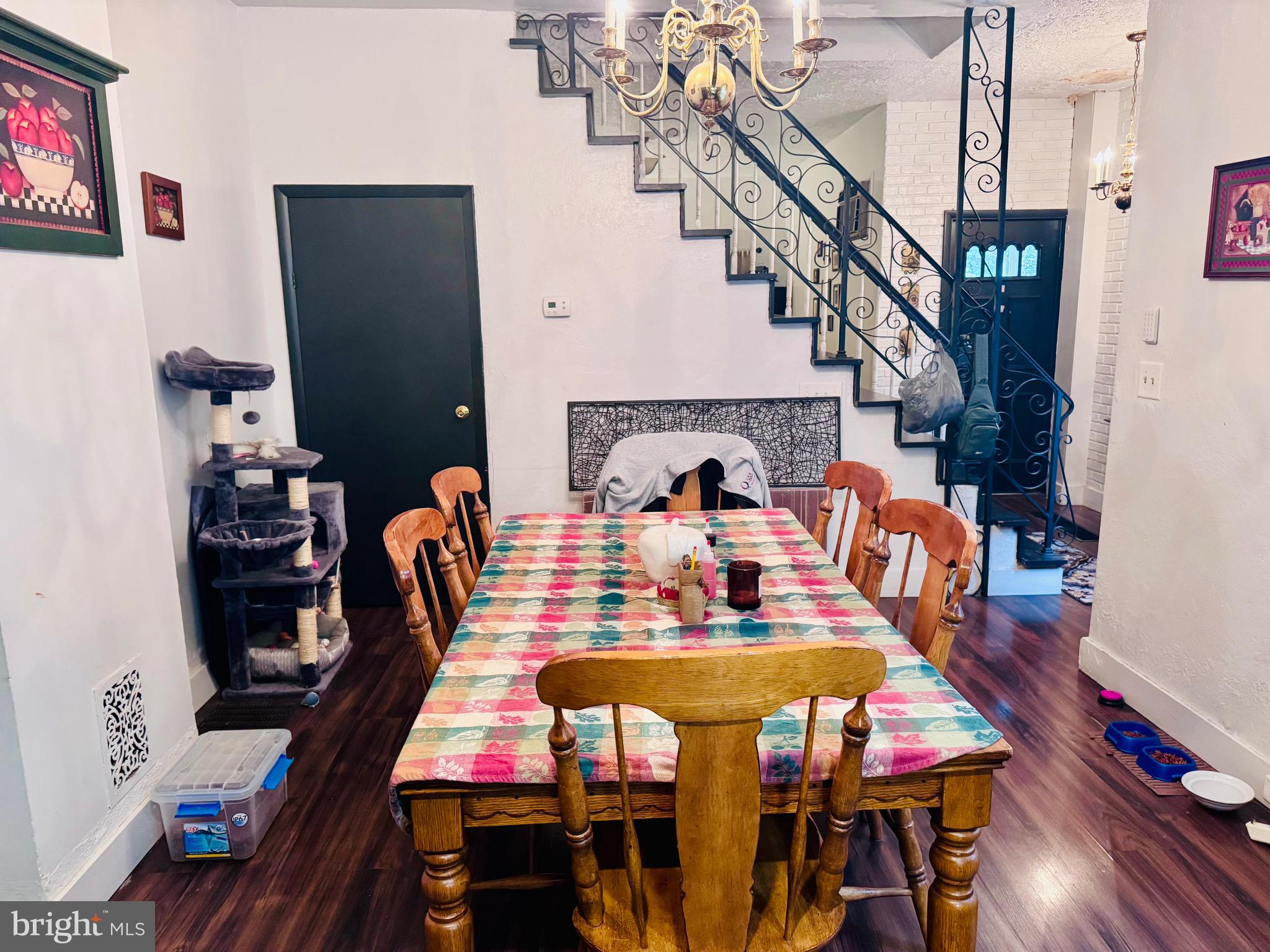 1128 North 6th Street Reading, PA 19601 - Photo 8 of 19 a view of a dining room with furniture wooden floor and chandelier