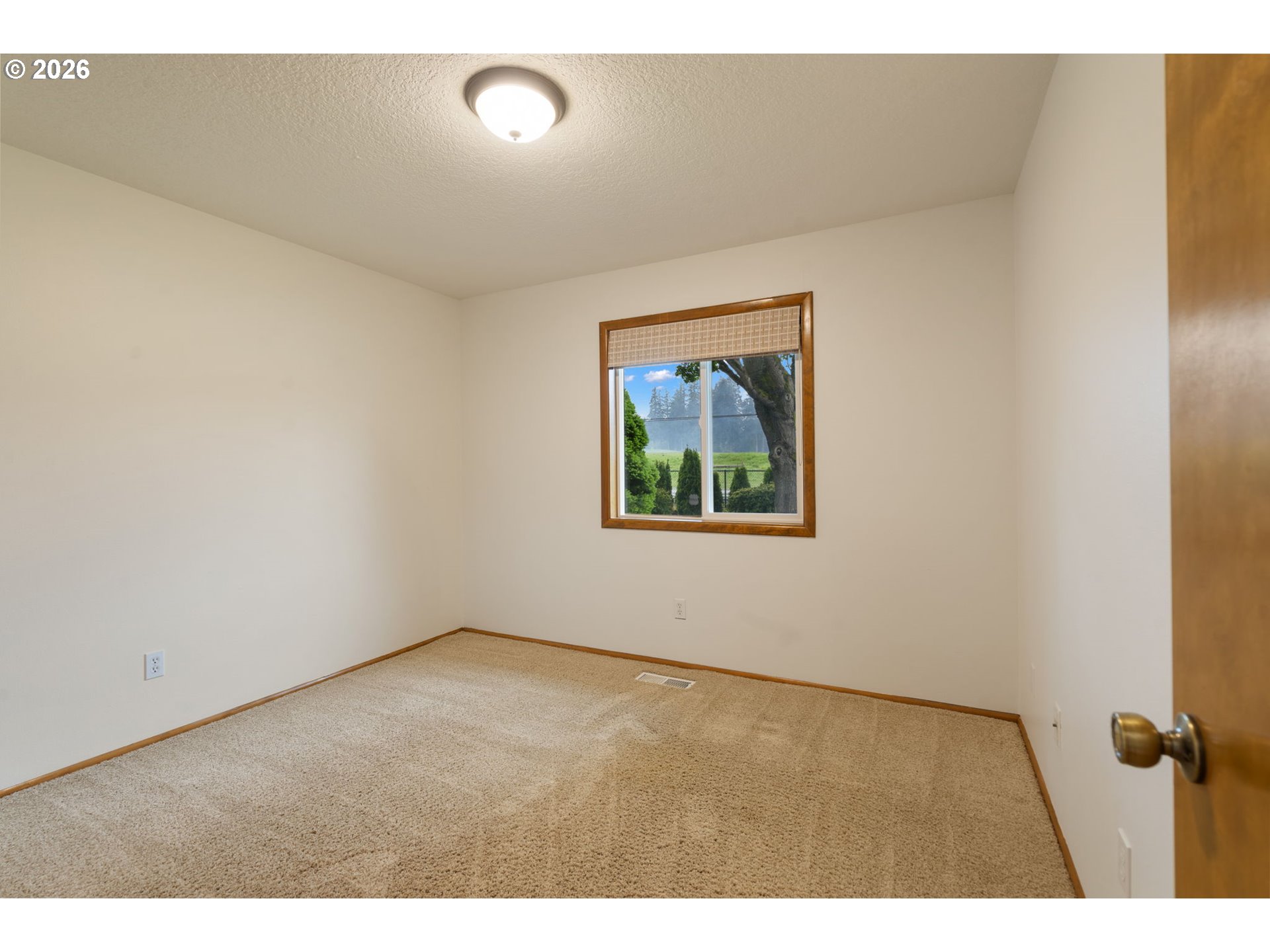 24950 Airport Road Northeast Aurora, OR 97002 - Photo 22 of 44 an empty room with a window