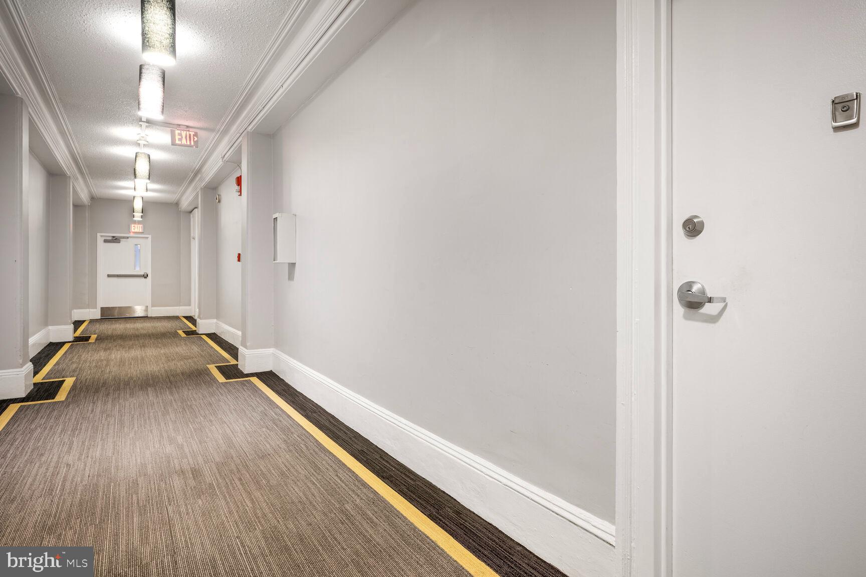 1401 Columbia Road Northwest, Unit 213 Washington, DC 20009 - Photo 14 of 14 a room with a walk in closet and wooden floor