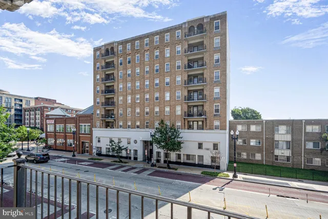a view of a building with city street
