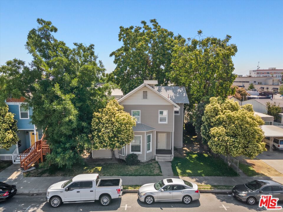 2020 F Street Bakersfield, CA 93301 - Photo 5 of 14 a car parked in front of a house with a car parked in front of it