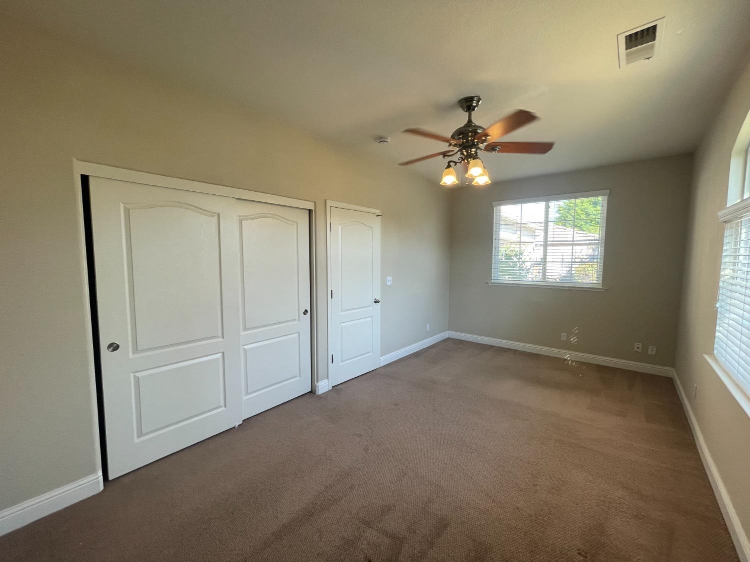 2616 Goshen Avenue Clovis, CA 93611 - Photo 19 of 39 a view of an empty room with a window