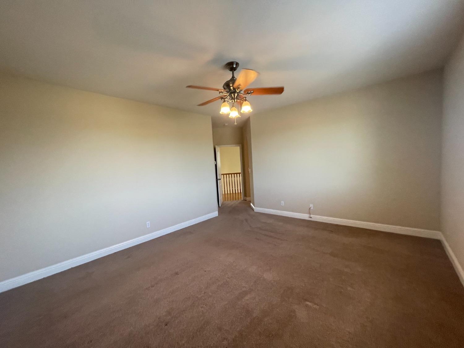 2616 Goshen Avenue Clovis, CA 93611 - Photo 33 of 39 a view of an empty room and chandelier fan