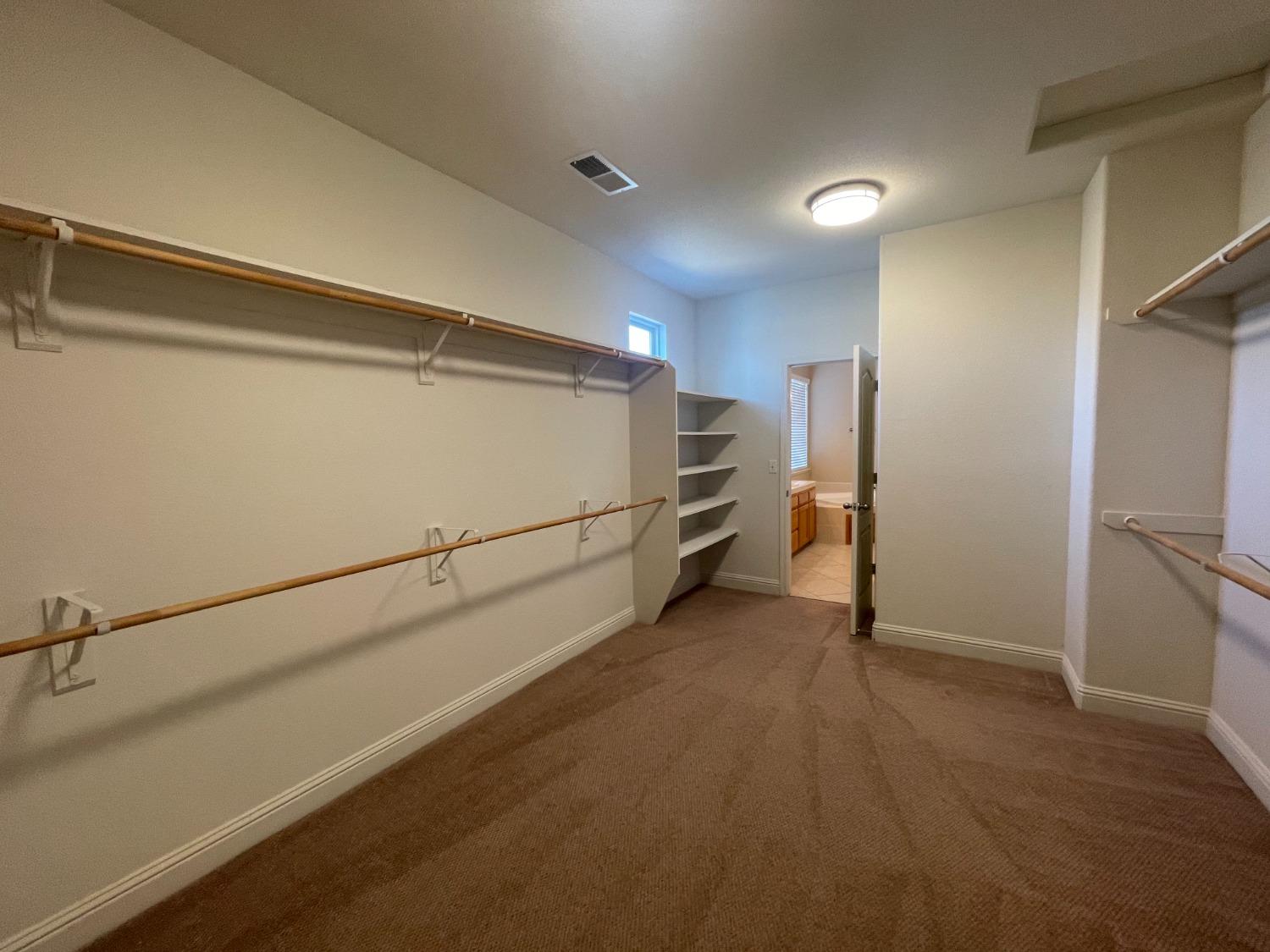 2616 Goshen Avenue Clovis, CA 93611 - Photo 35 of 39 a view of a refrigerator in kitchen and an empty room