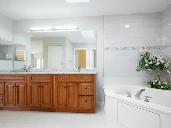 a view of a kitchen with wooden floor and electronic appliances