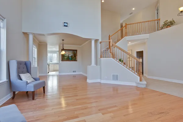 a view of livingroom and dining room with wooden floor