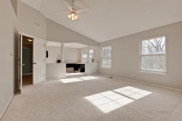 a view of an empty room with a window