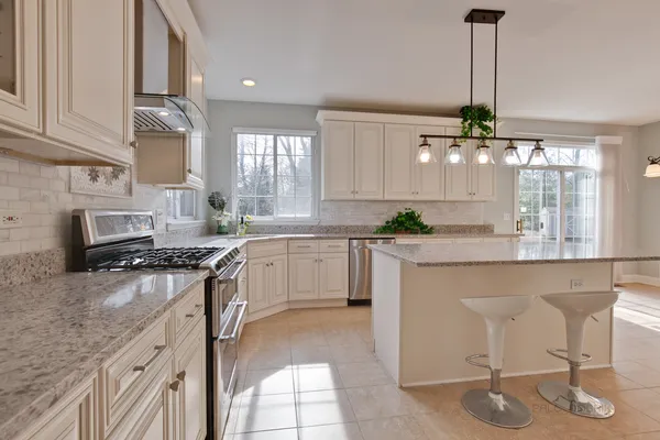 a kitchen with a sink cabinets and window